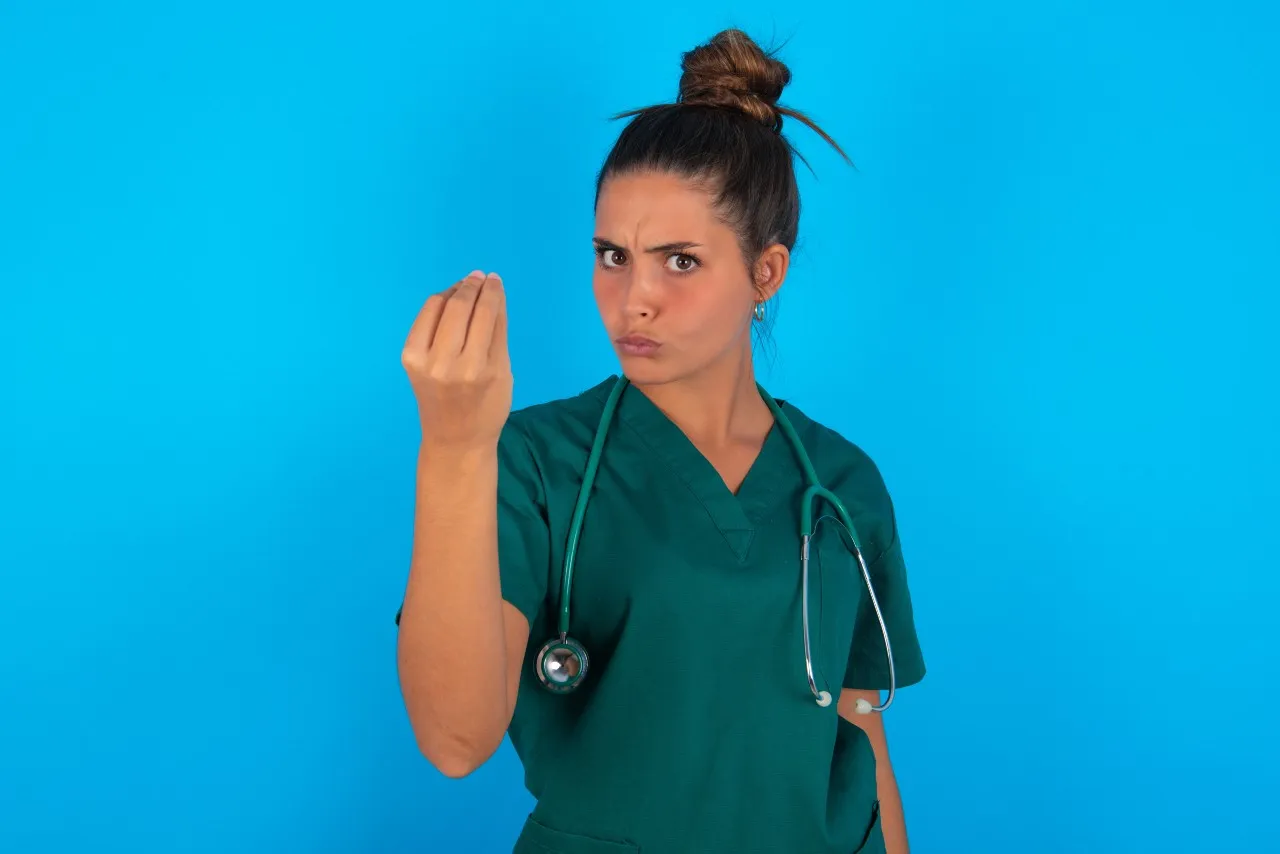 picture of a nurse signalling money with her hands